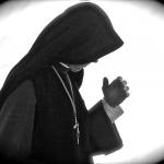 "Nun Deep in Prayer" © Robert Frank Gabriel; Creative Commons license